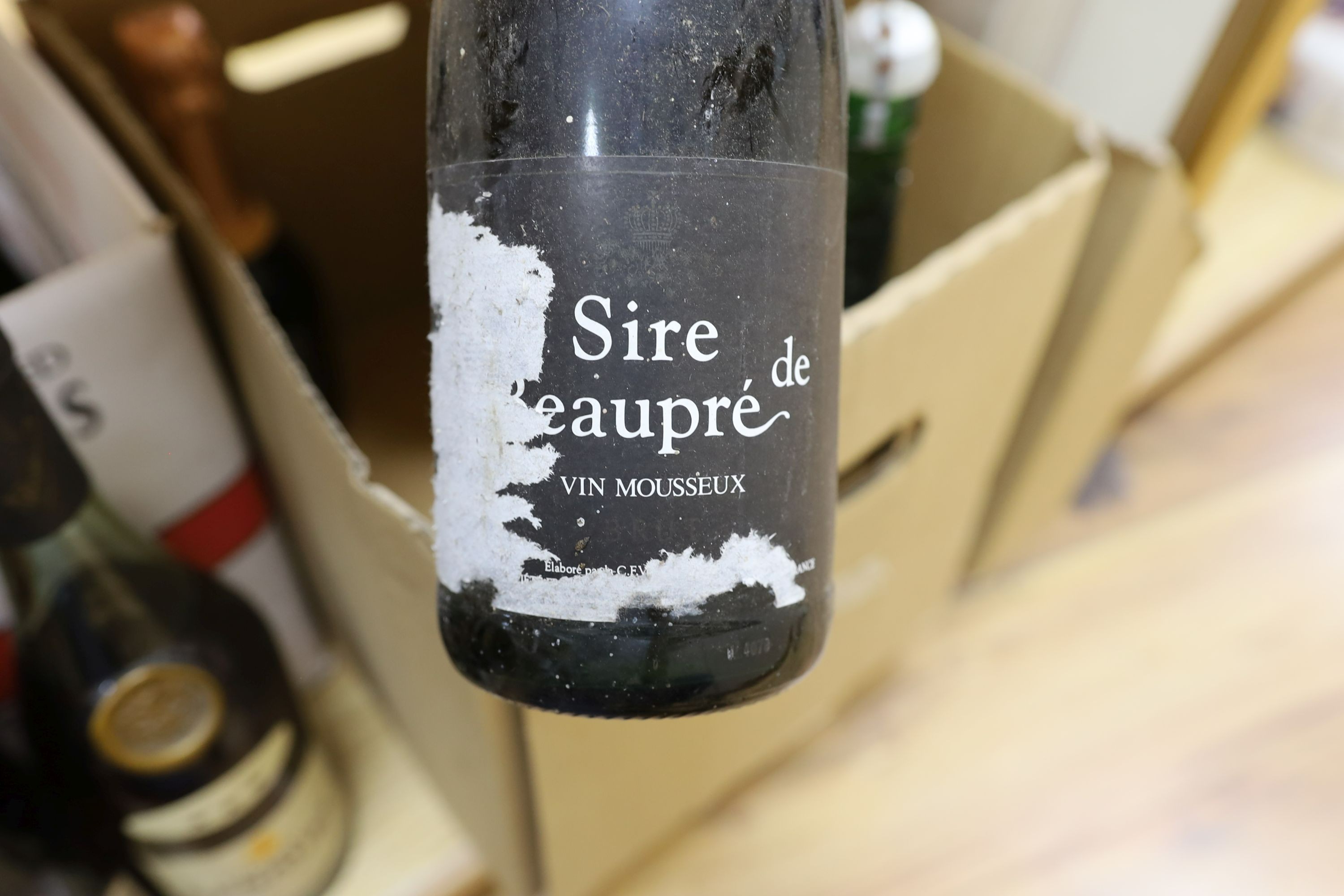 A group of wines and champagnes including Chateau La Coustere, Laurent-Perrier, L.Gardner and a bottle of Renault cognac